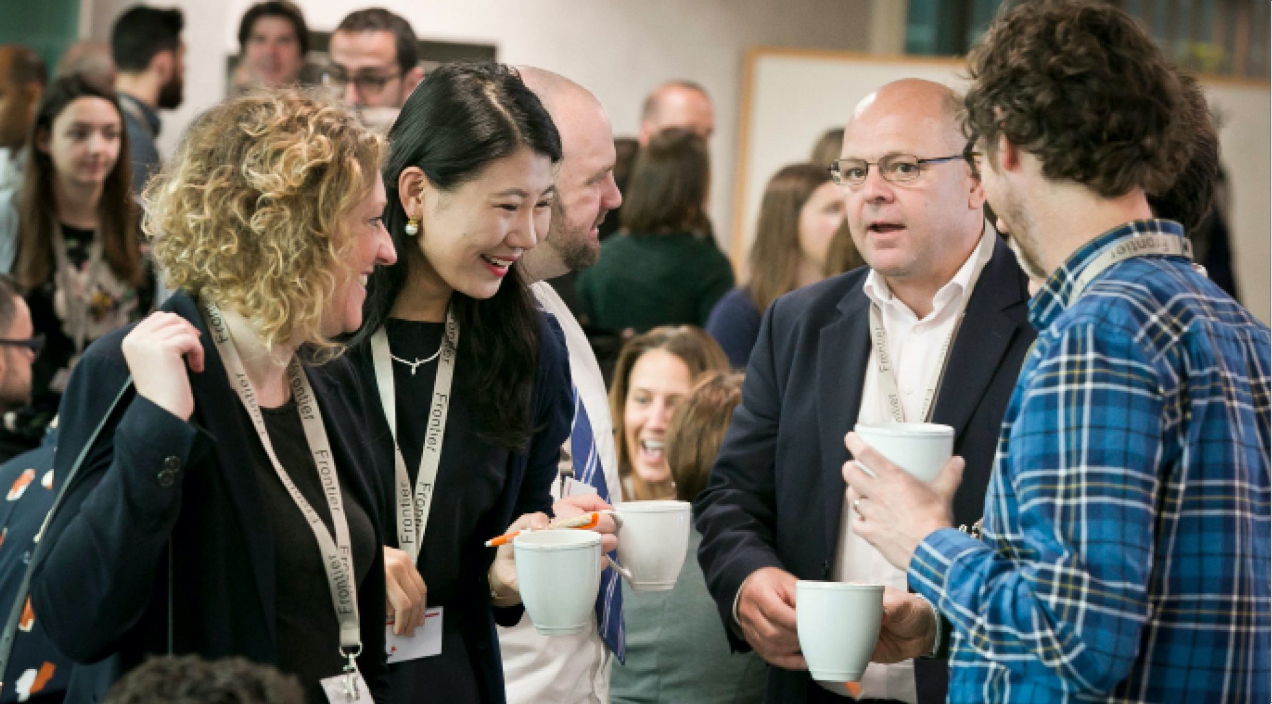 Group of people talking at an event